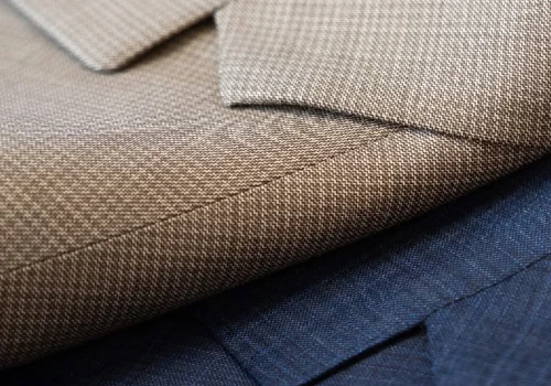 Closeup showing fabric in men's suit jacket