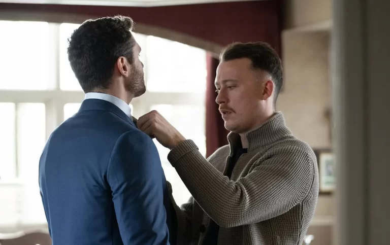 Man standing being fitting for a suit by ER Fisher team member