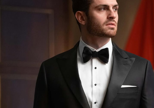 Man wearing formal attire with bow tie