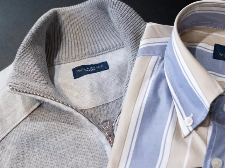 Closeup of men's casual button shirt and pullover from Paul and Shark