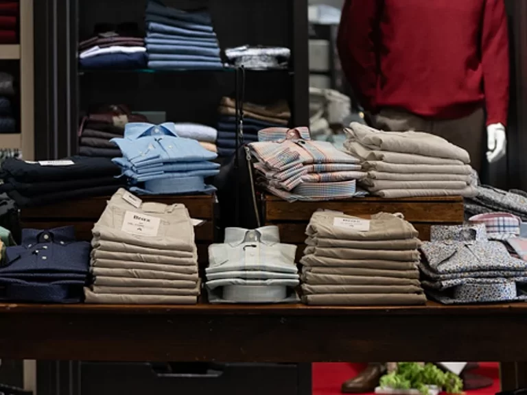 Interior display showing men's casual shirts and trousers