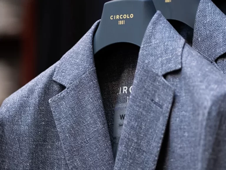 Closeup of suit jacket on hanger