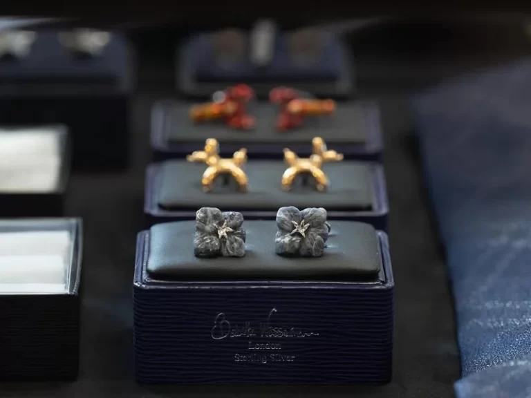 Closeup image showing Babette Wasserman cuff links in stirling silver and gold