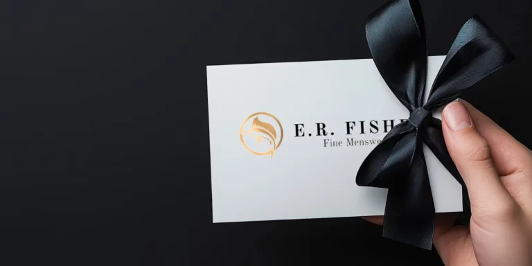hand holding a ER Fisher Gift Card with bow