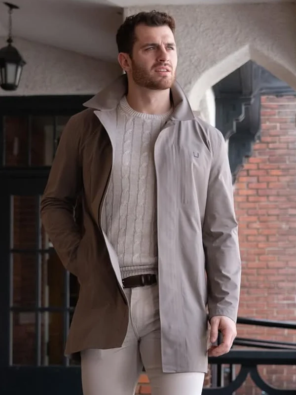 Man standing outside wearing long jacket