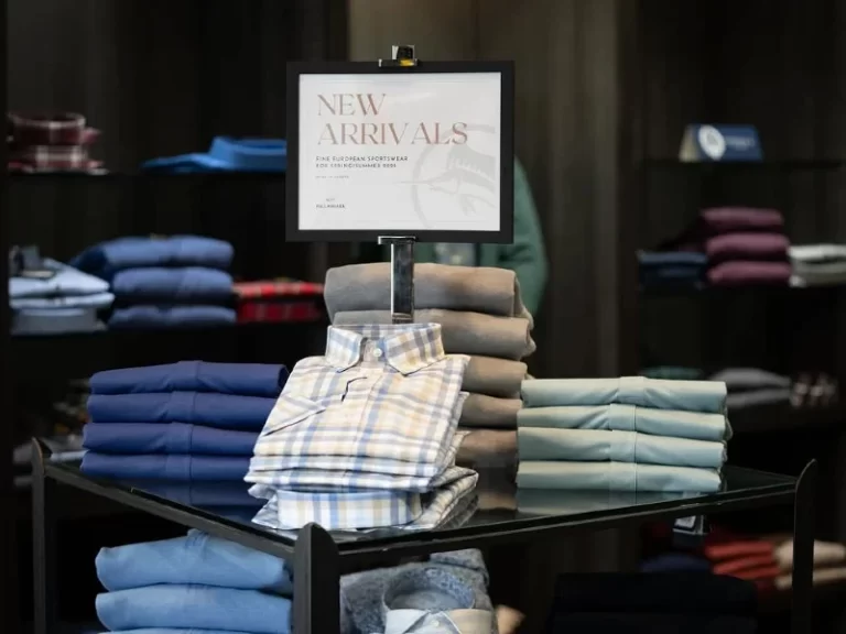 Interior store display showing men's casual button shirts