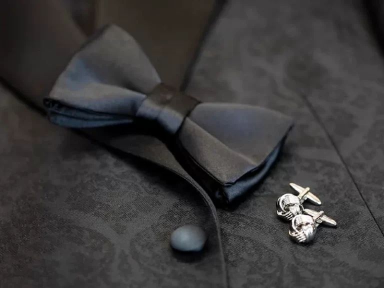 Men's formal attire with bow tie and cuff links