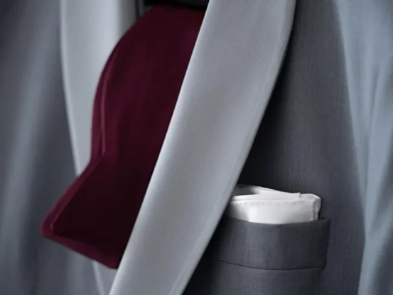 Closeup of men's formal suit jacket, tie and pocket square
